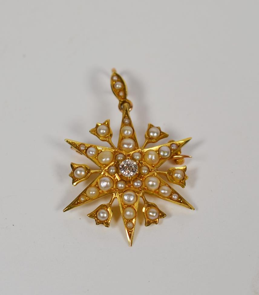 Lot 64 - A 15 carat gold Victorian star brooch/pendant set with diamond and split pearls, measures 2.7cm...