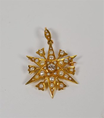 Lot 64 - A 15 carat gold Victorian star brooch/pendant set with diamond and split pearls, measures 2.7cm...