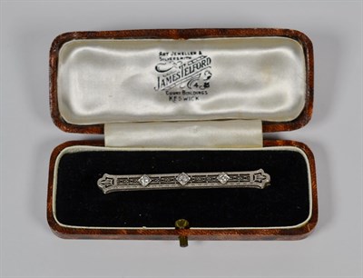Lot 65 - A diamond set bar brooch, length 6cm, cased