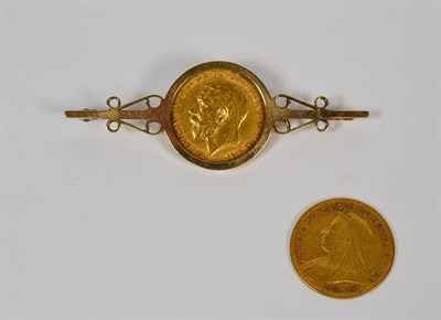 Lot 69 - A 1911 sovereign mounted as a bar brooch, length 5.6cm; and an 1898 half sovereign