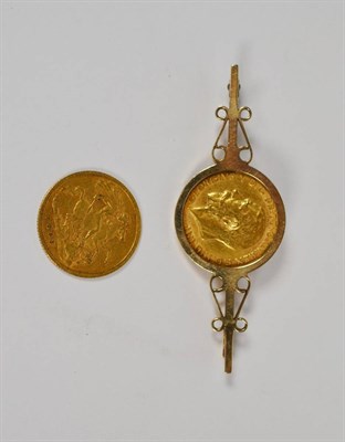 Lot 69 - A 1911 sovereign mounted as a bar brooch, length 5.6cm; and an 1898 half sovereign