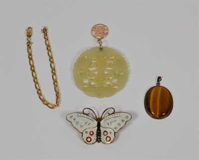 Lot 80 - A jade type disc with attached charm stamped '14K'; a Norwegian enamelled butterfly brooch; a 9...