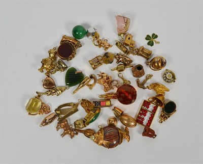 Lot 83 - Approximately fifty charms, including a globe, an abacus, a rose quartz Buddha, a fish etc