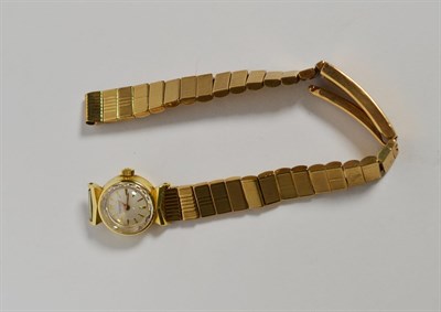 Lot 92 - A ladies 14 carat gold wristwatch with attached 9 carat gold bracelet