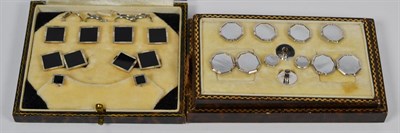 Lot 105 - A cased set of onyx dress studs and cufflinks, stamped '9CT & 18CT'; and another cased set of...