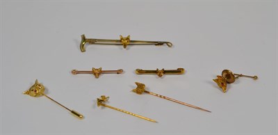 Lot 106 - Three fox head stick pins; three fox head bar brooches; and a 9 carat gold fox head tie stud