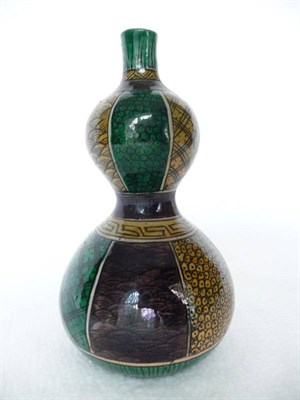 Lot 155 - A Japanese Kutani Double Gourd Vase, 19th century, painted in black, aubergine, green and...