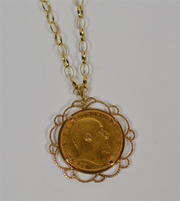 Lot 110 - A 1906 sovereign mounted in a 9 carat gold frame as a pendant on a chain stamped '9K', chain length