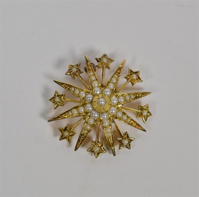 Lot 111 - An early 20th century 9 carat gold seed pearl star brooch, diameter 3.2cm