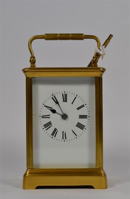 Lot 118 - A large brass cased carriage clock, early 20th century, with key