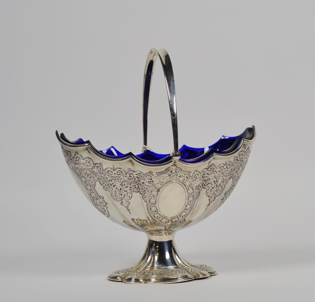 Lot 122 - A Victorian silver sugar bowl, by Martin and Hall, London, 1879, in the Georgian style, fluted oval