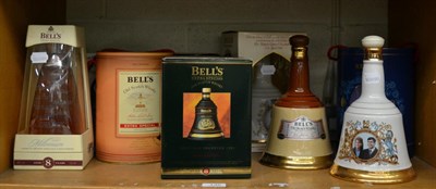Lot 135 - A group of nine Bells commemorative whiskey decanters