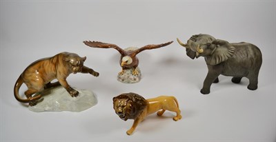 Lot 142 - Beswick wild animals comprising, puma on rocks, 1702, bald eagle, 1018, a Lion and a matt...