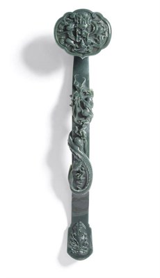 Lot 159 - A Chinese Jadeite Ruyi Sceptre, 20th century, the cloud scroll shaped head carved in relief...