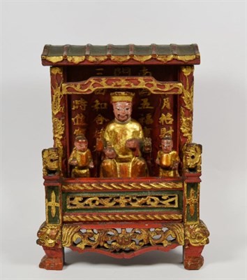 Lot 151 - Chinese domestic shrine with three carved wood figures