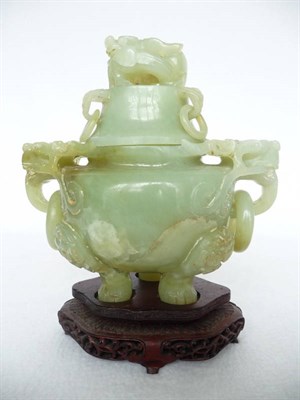 Lot 160 - A Chinese Jadeite Jar and Cover, 19th century, with dragon knop and dragon mask and loop...