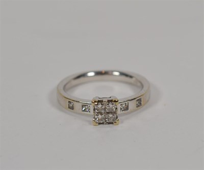 Lot 162 - A diamond cluster ring, stamped '18K', finger size O