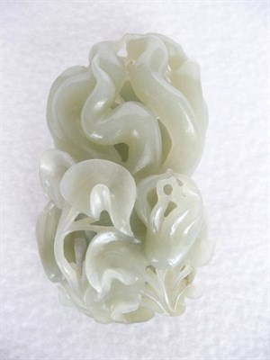 Lot 161 - A Chinese Jade Model of a Finger Citron, Qing Dynasty, the carved and pierced fruit issuing...