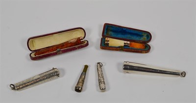 Lot 172 - Hinged silver cheroot case and holder, another with chased decoration, smaller example and two...