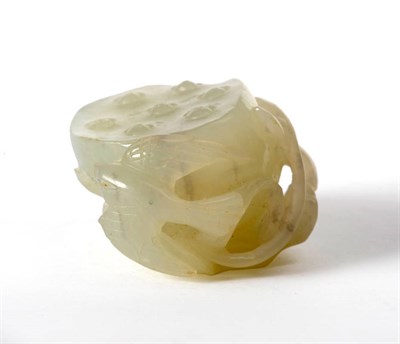 Lot 165 - A Chinese Pale Green Jade Carving of a Lotus Pod, Qianlong, on a leaf with a bird and snail,...
