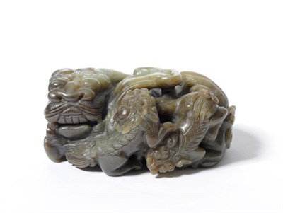 Lot 168 - A Chinese Carved Jade Group of Lion Dog and Two Cubs, probably early 20th century, the...