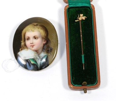 Lot 248 - A seed pearl stick pin, stamped '15CT'; and a porcelain miniature brooch