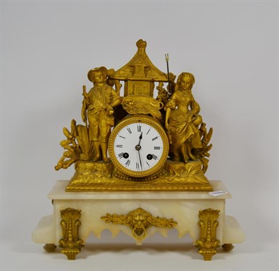 Lot 258 - A gilt metal mounted figural mantel clock with enamel dial