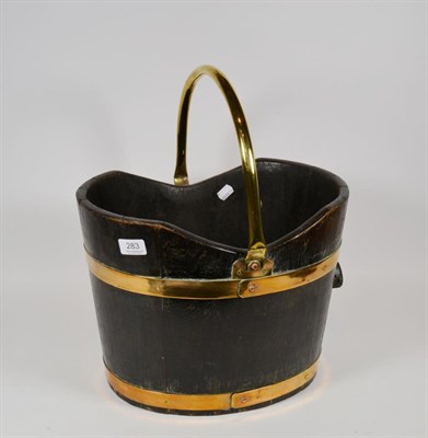 Lot 283 - A Victorian brass bound coal scuttle