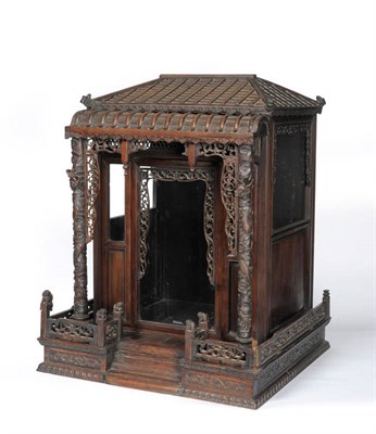 Lot 173 - A Chinese Carved Hardwood Shrine, 19th century, of architectural form with pitched roof, glazed...