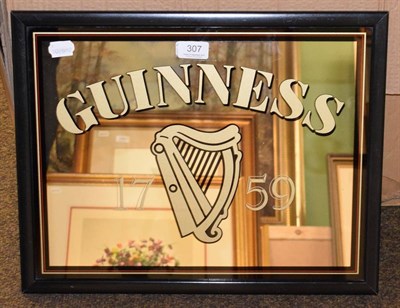 Lot 307 - A Guinness pub advertising mirror with black, red and gilt border, 37cm by 47cm including frame