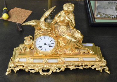 Lot 312 - A gilt metal figural mantel clock, of a seated maiden