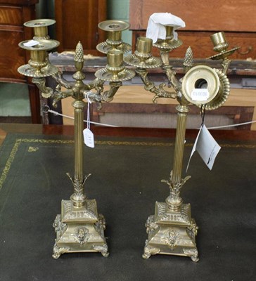 Lot 313 - A pair of Victorian brass candelabras