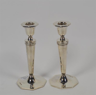 Lot 315 - A pair of silver candlesticks, by Walker & Hall, Sheffield, loaded bases, 17cm high (2)