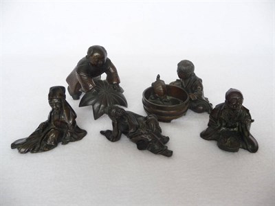 Lot 177 - A Japanese Bronze Figure of a Sage, Meiji period (1868-1912), seated on the ground holding a...