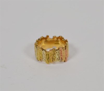 Lot 345 - A 9 carat three colour gold textured band ring, finger size Q1/2