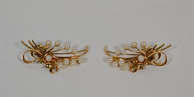 Lot 349 - A pair of pearl set spray ear clips, one stamped '14K', measure 3.0cm by 5.5cm