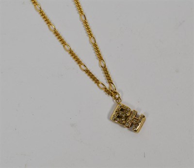 Lot 352 - An initialled pendant 'BH' on a 9 carat gold figaro chain, length 50cm