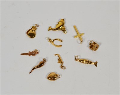 Lot 354 - Four 9 carat gold charms including a fish, a cross, a wishbone etc; two charms stamped '9CT'...