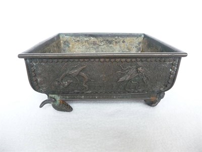 Lot 180 - A Chinese Bronze Square Bowl, Qing Dynasty, cast with dragons and birds on a keywork and scroll...
