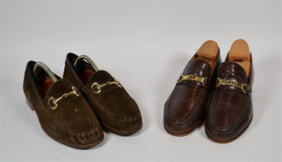 Lot 384 - Pair of Gucci gentleman's brown leather loafers, with gilt metal interlocking GG mounts (size 41) 