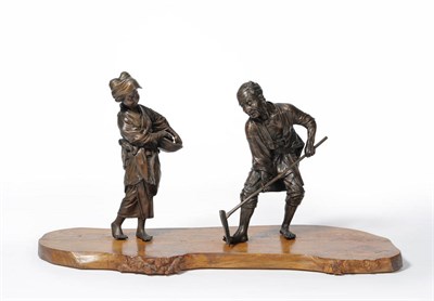 Lot 184 - A Pair of Japanese Bronze Figures of a Farmer and His Wife, Meiji period (1868-1912), he...