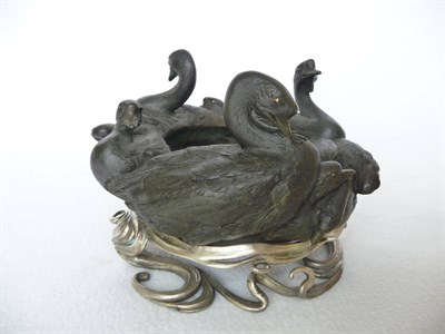 Lot 187 - A Japanese Bronze Bowl, Meiji period (1868-1912), cast in the form of seven ducks swimming in a...