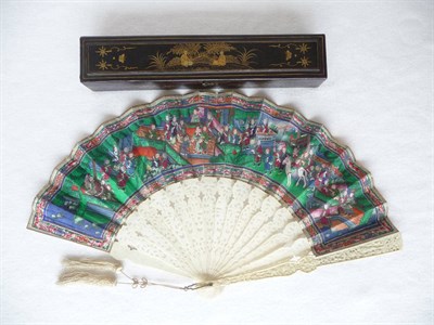 Lot 190 - A Canton Ivory and Painted Fan, 19th century, painted with courtly figures in gardens and...