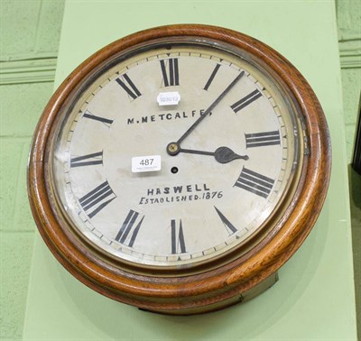 Lot 487 - Oak framed circular wall clock, bearing the name 'M Metcalfe, Haswell' with key