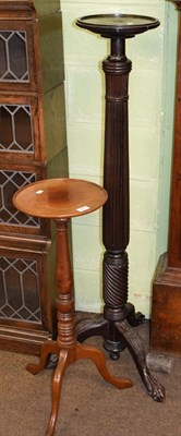 Lot 489 - A mahogany tripod torchere and a later example with reeded column