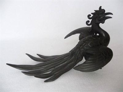 Lot 192 - A Japanese Bronze Figure of a Phoenix, Meiji period (1868-1912), standing with wings partially...