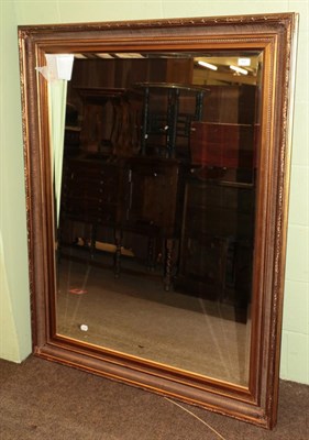 Lot 501 - Reproduction gilt bevel glass mirror with moulded frame, 144cm by 112cm