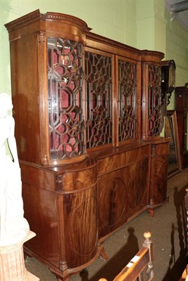 Lot 502 - A George III breakfront bookcase, the moulded and dentil cornice above two glazed doors flanked...