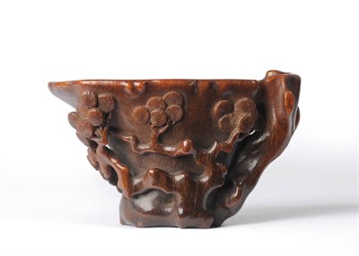 Lot 194 - A Chinese Carved Rhinoceros Horn Libation Cup, circa 1700, of attractive and toned toffee...