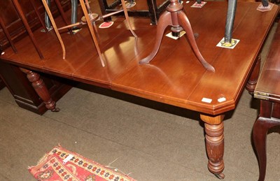 Lot 514 - A late Victorian walnut extending dining table, with two additional leaves and winding handle,...